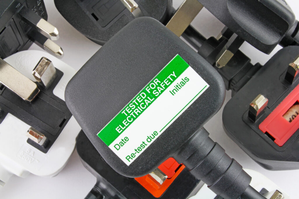 Plan,View,Of,Plugs,,Blurred,Background,Of,Three,Pin